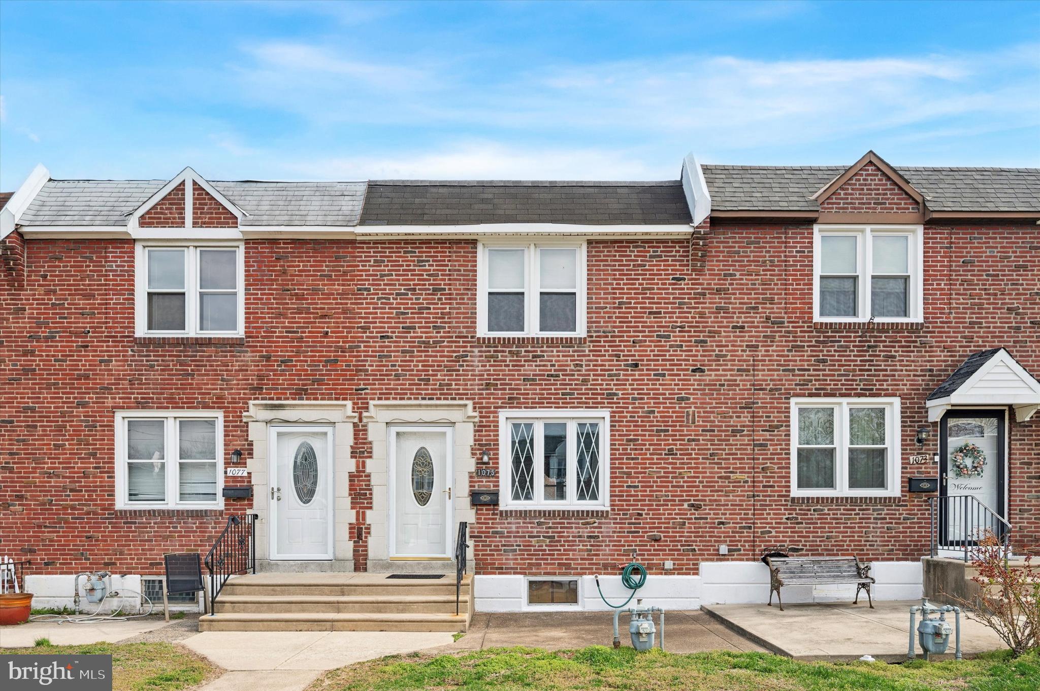 1075 Stratford Road Glenolden, PA 19036 - Photo 1 of 15 a front view of a house with a yard