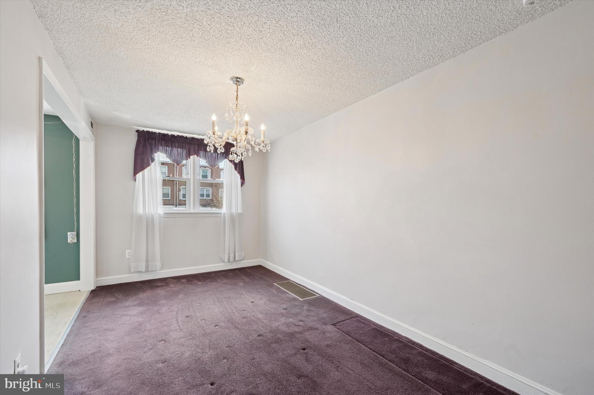 1075 Stratford Road Glenolden, PA 19036 - Photo 5 of 15 wooden floor in an empty room with a window