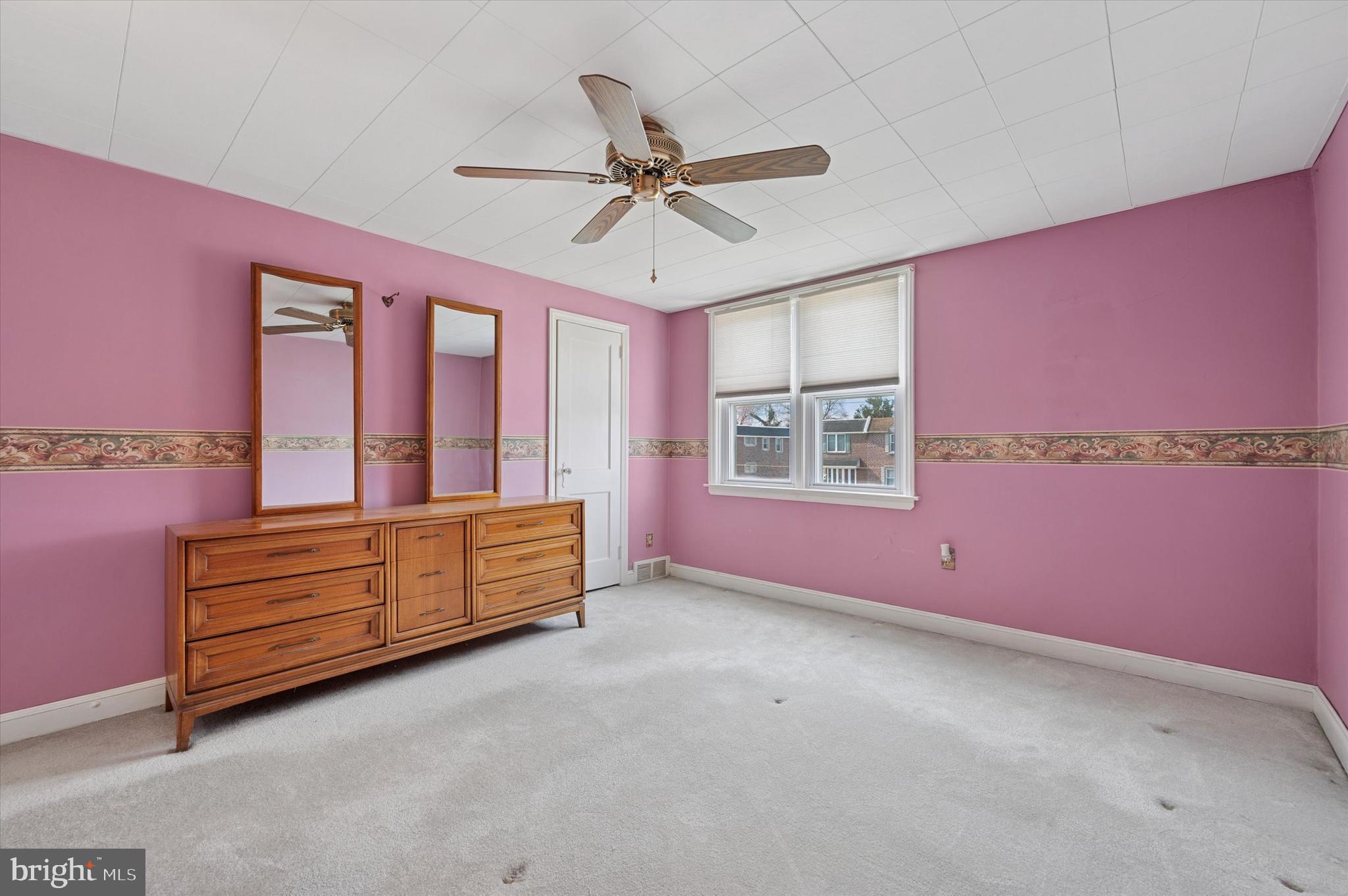 1075 Stratford Road Glenolden, PA 19036 - Photo 9 of 15 a bedroom with furniture and window