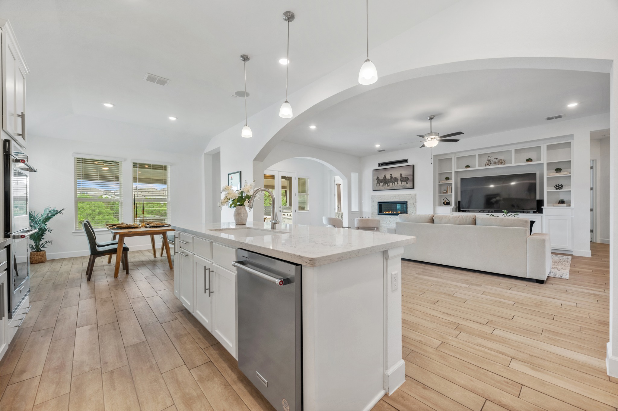 606 Bonfisk Bend Austin, TX 78738 - Photo 13 of 40 a kitchen with stainless steel appliances granite countertop a stove and a sink