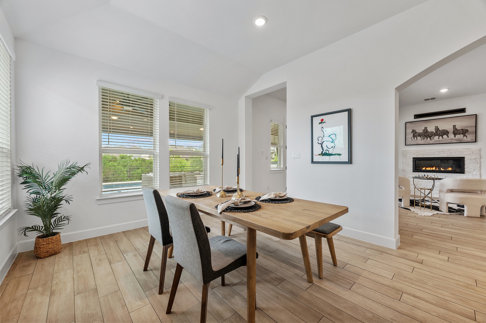 606 Bonfisk Bend Austin, TX 78738 - Photo 15 of 40 a view of a dining room with furniture window and wooden floor