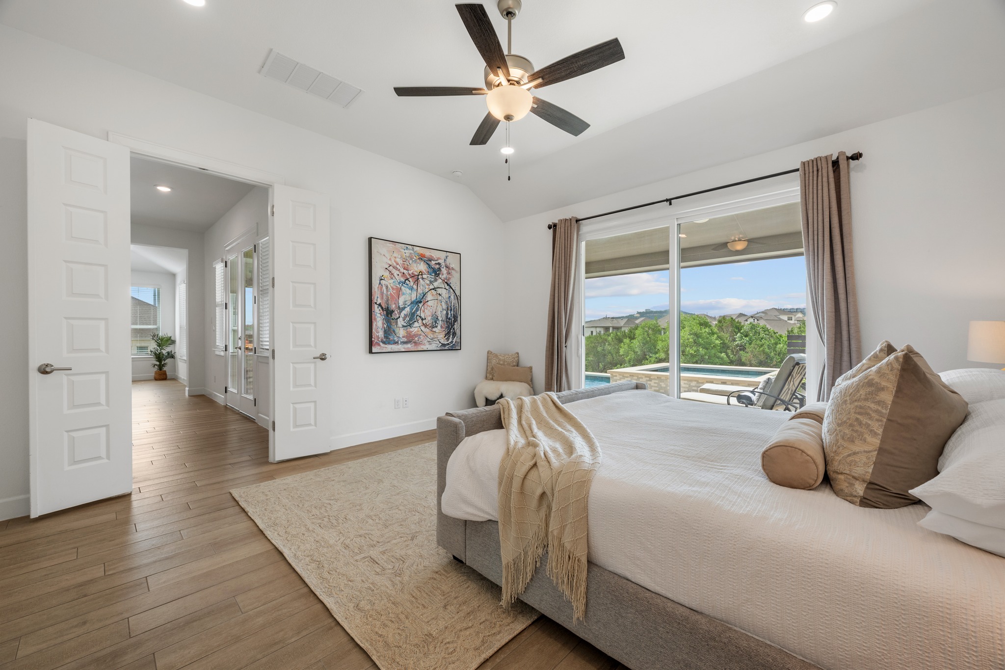 606 Bonfisk Bend Austin, TX 78738 - Photo 17 of 40 a bed room with a bed and a large window