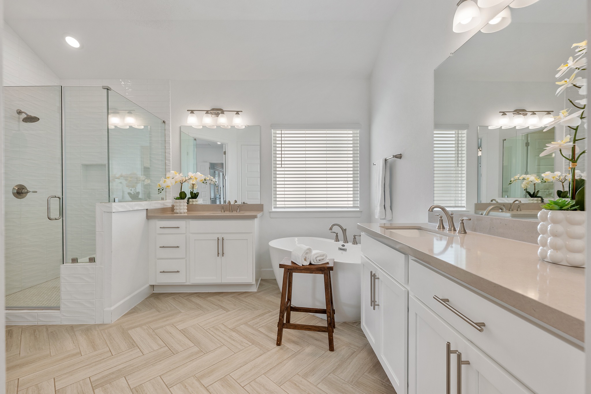 606 Bonfisk Bend Austin, TX 78738 - Photo 18 of 40 a spacious bathroom with a granite countertop sink mirror and a