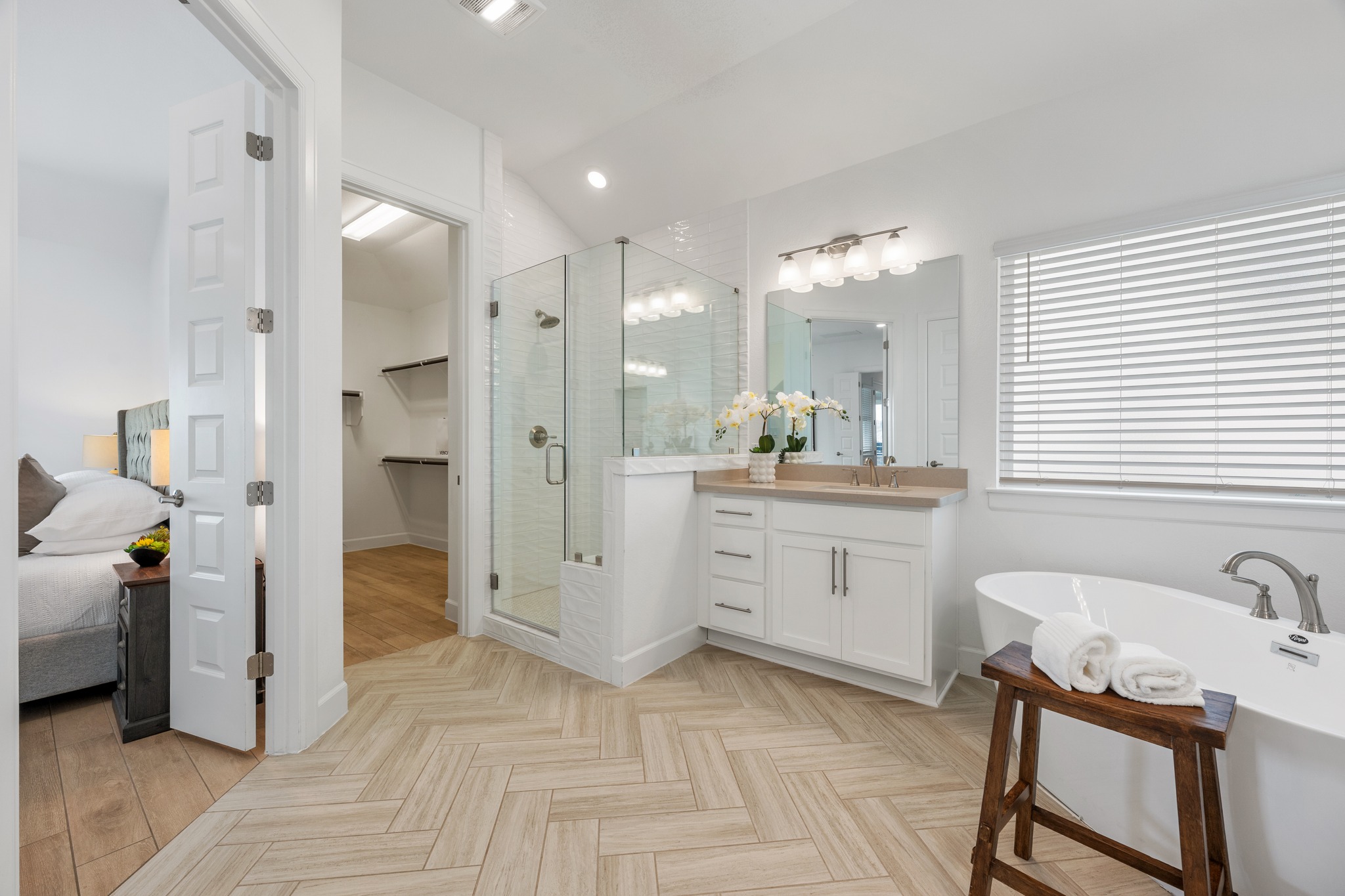 606 Bonfisk Bend Austin, TX 78738 - Photo 19 of 40 a bathroom with a sink double vanity granite tub shower and mirror