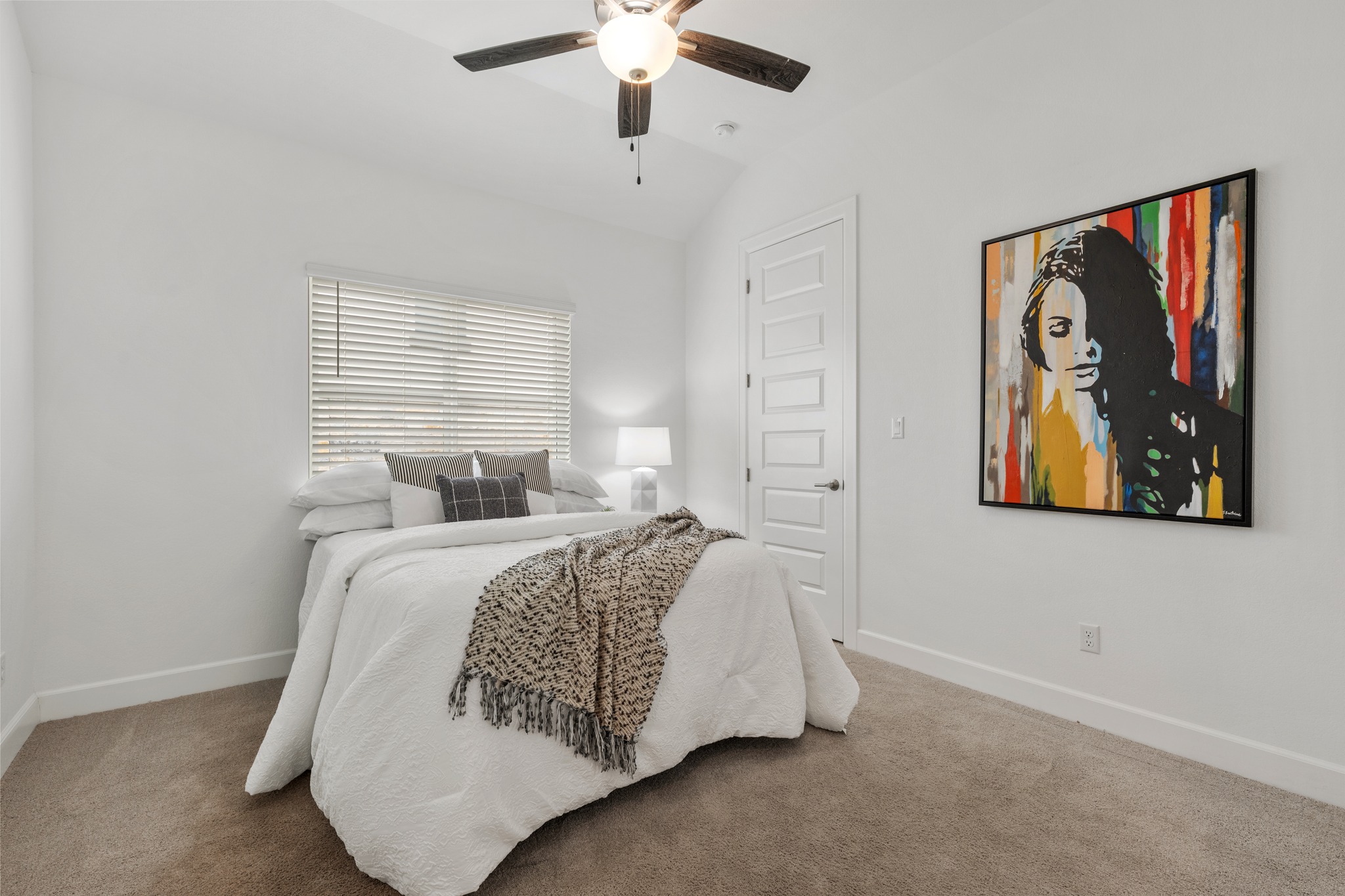 606 Bonfisk Bend Austin, TX 78738 - Photo 28 of 40 a bedroom with a bed and a painting on the wall