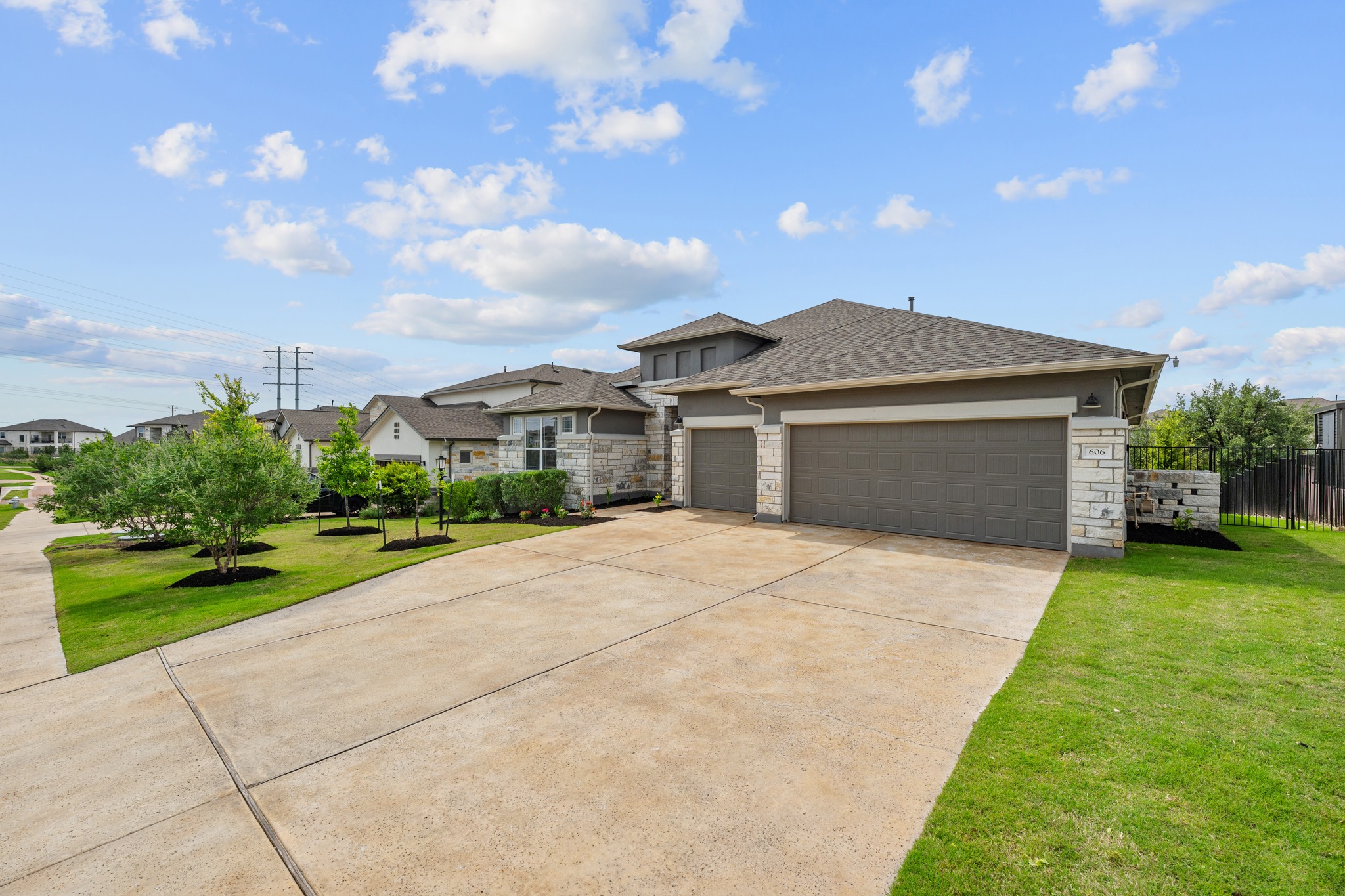 606 Bonfisk Bend Austin, TX 78738 - Photo 2 of 40 a front view of house with yard and green space