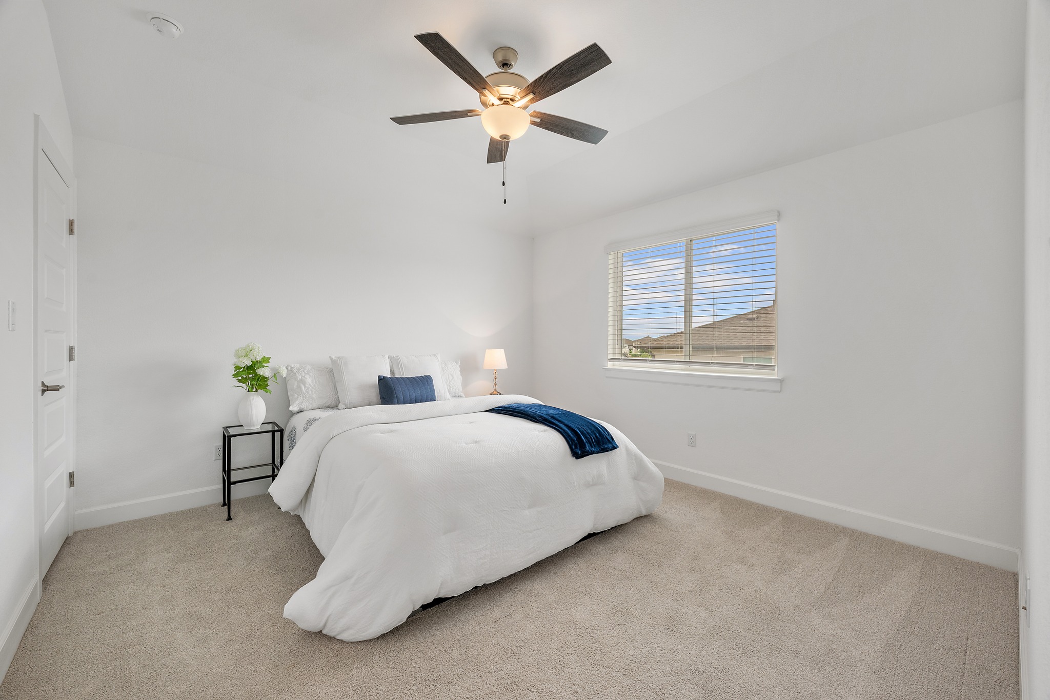 606 Bonfisk Bend Austin, TX 78738 - Photo 31 of 40 a bedroom with a bed and window