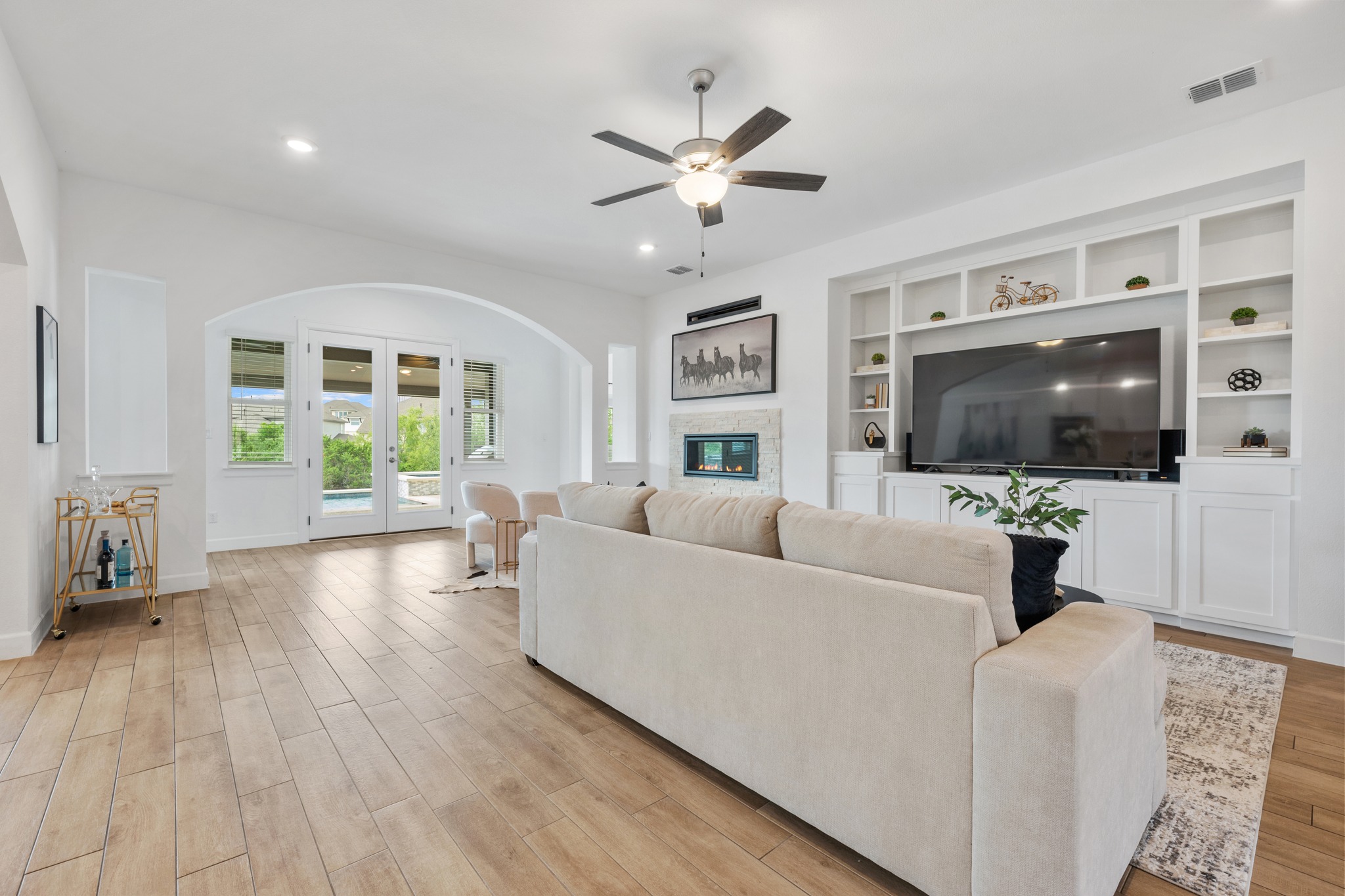 606 Bonfisk Bend Austin, TX 78738 - Photo 8 of 40 a living room with furniture and a flat screen tv