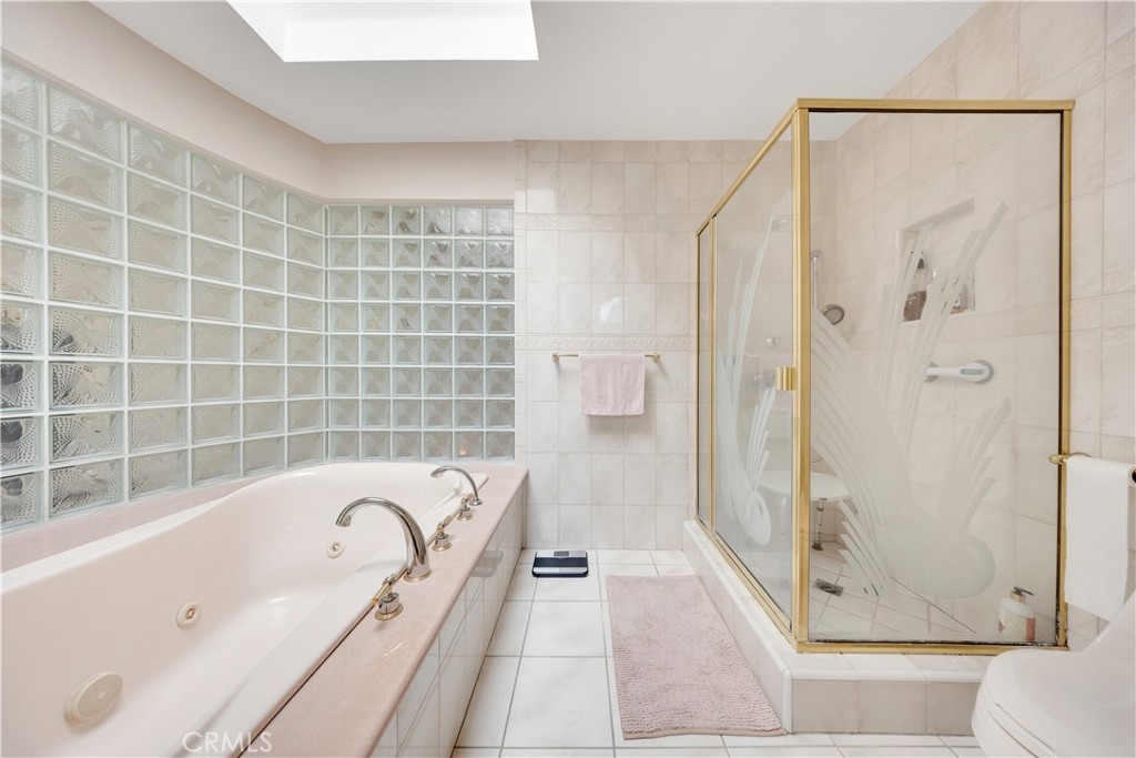2835 Devonport Road San Marino, CA 91108 - Photo 40 of 54 a bathroom with a tub a toilet and a shower