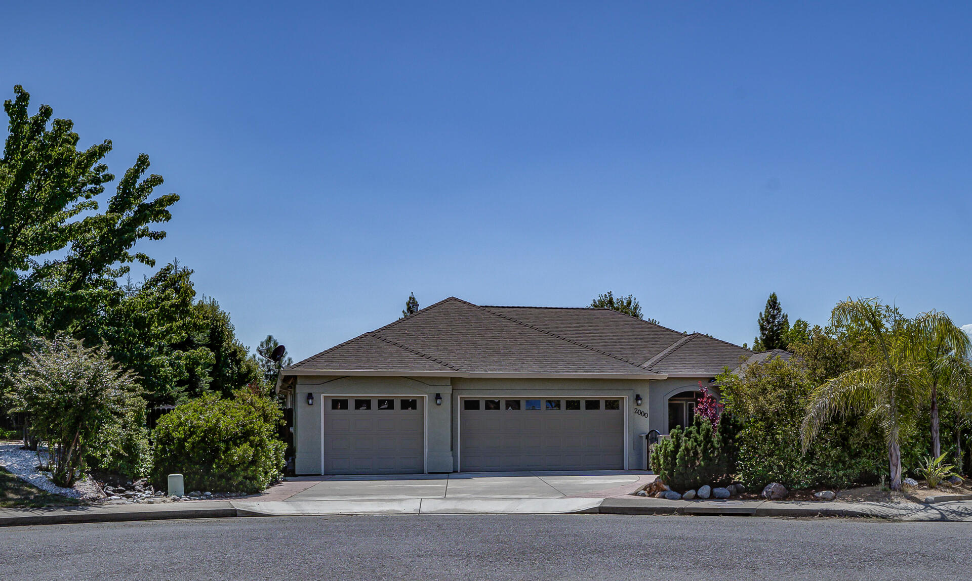 front view of a house with a garden