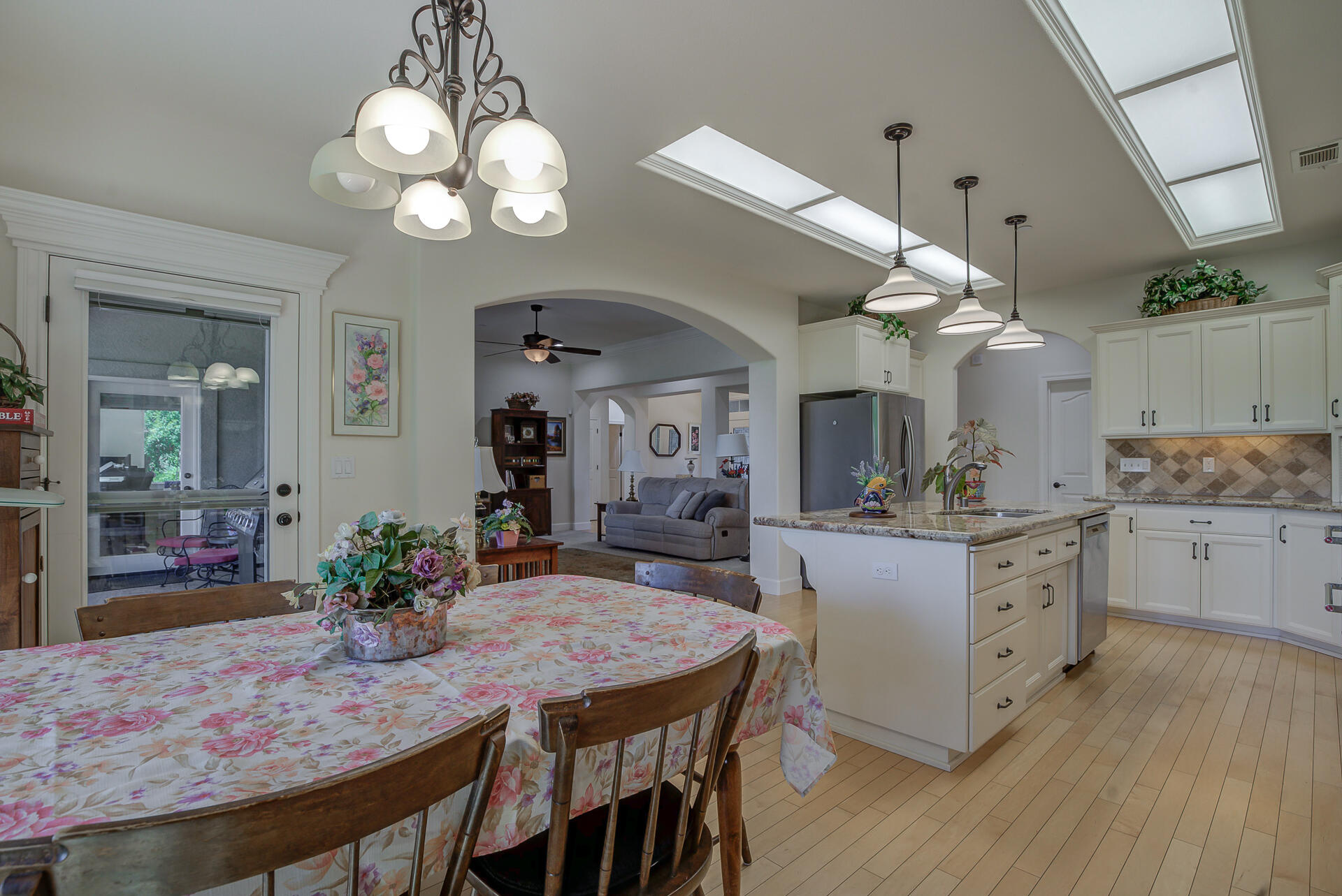 2000 Princeton Way Redding, CA 96003 - Photo 18 of 60 a view of a dining room with furniture and wooden floor