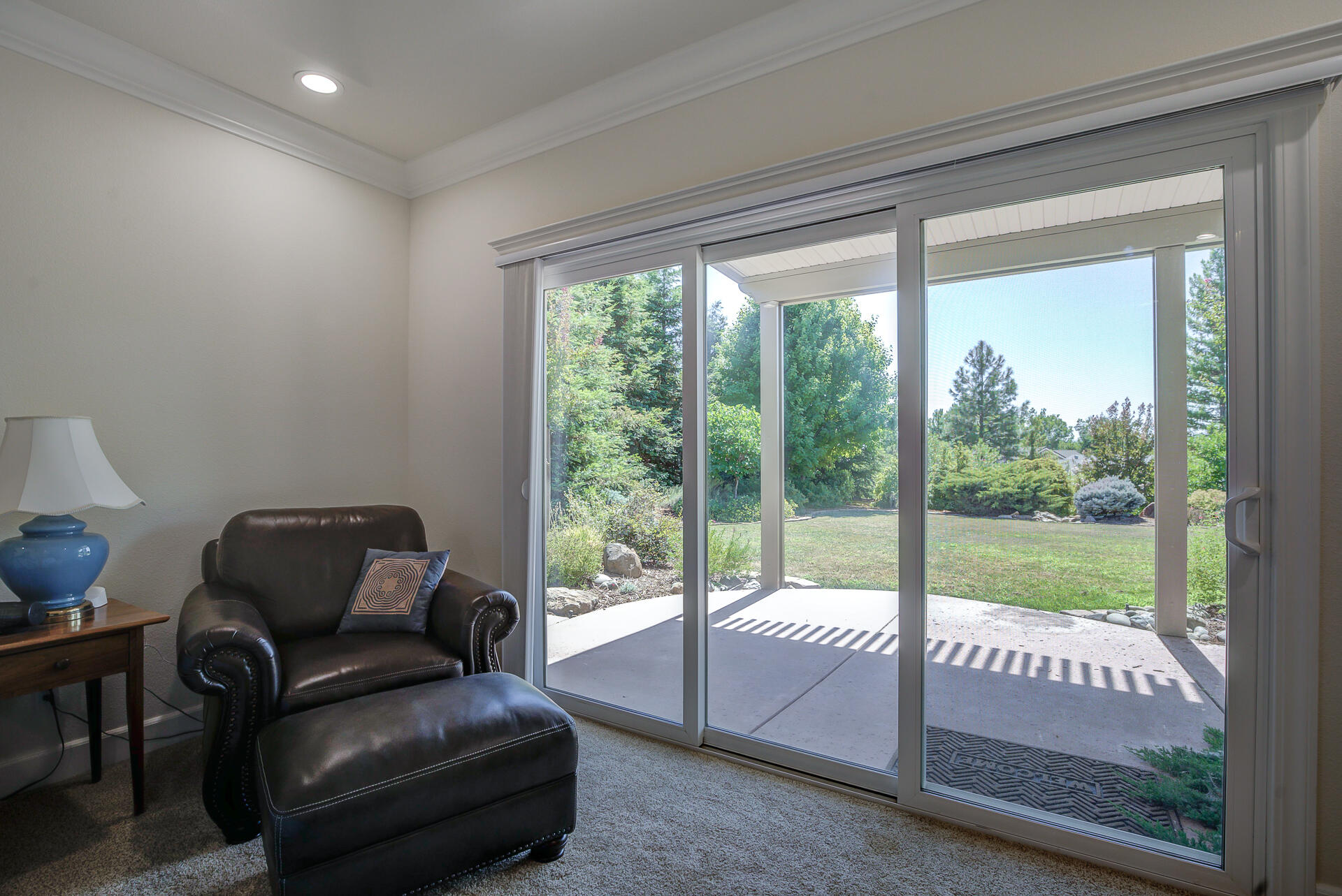 2000 Princeton Way Redding, CA 96003 - Photo 27 of 60 a living room with furniture and a floor to ceiling window