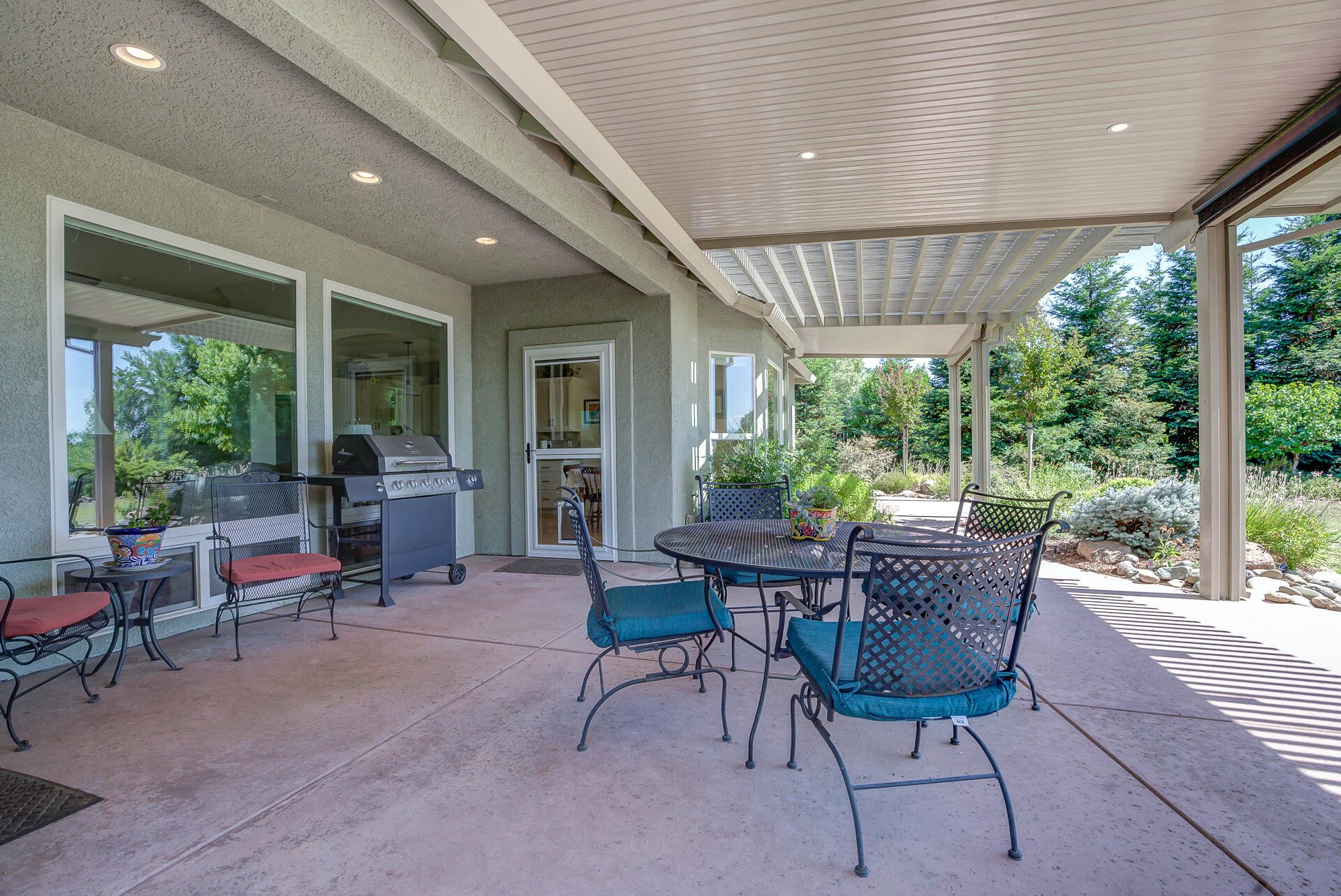 2000 Princeton Way Redding, CA 96003 - Photo 48 of 60 a patio with yard glass top table and chairs