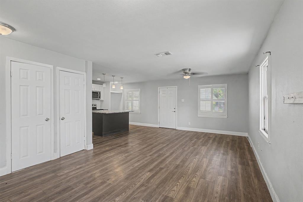 2508 Hillglenn Road Dallas, TX 75228 - Photo 22 of 26 wooden floor in an empty room with a window