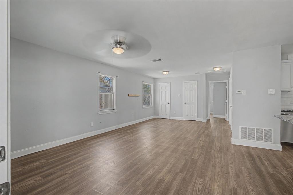 2508 Hillglenn Road Dallas, TX 75228 - Photo 24 of 26 a view of an empty room with wooden floor