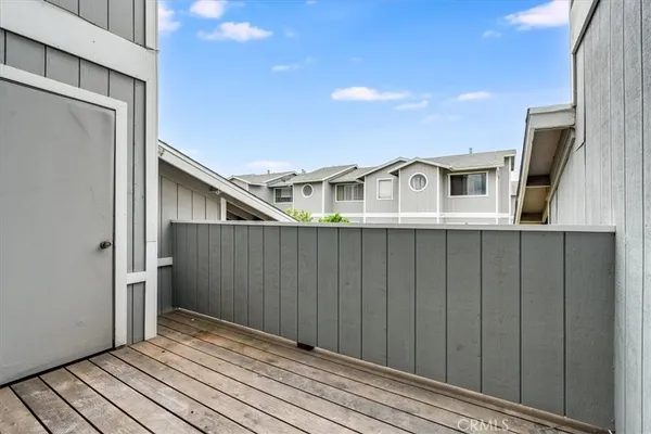 a view of a house with wooden deck