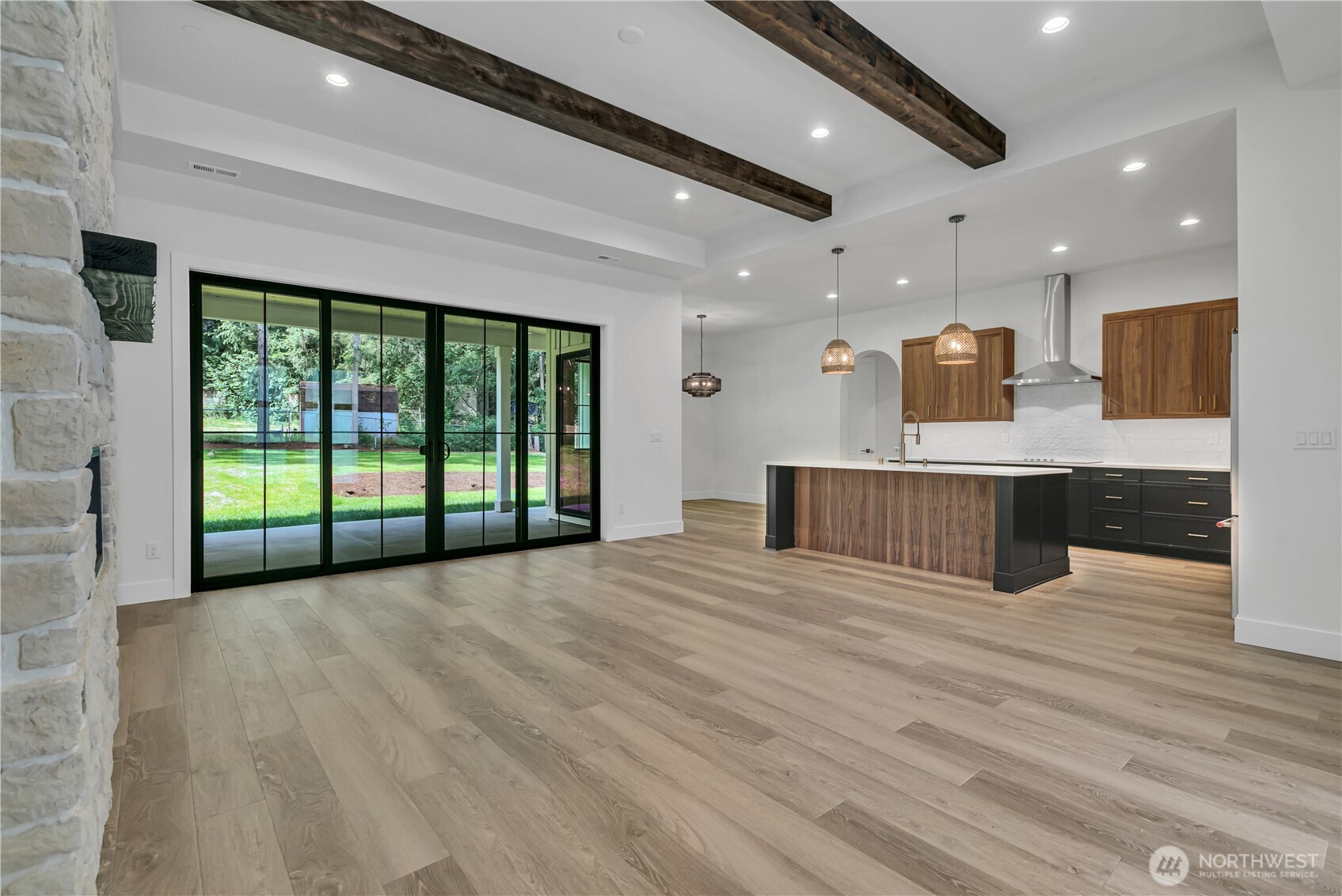 6709 254th Street East Graham, WA 98338 - Photo 6 of 40 a view of kitchen with stainless steel appliances wooden floor and large window