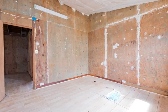 a view of a bathroom with a tub and shower
