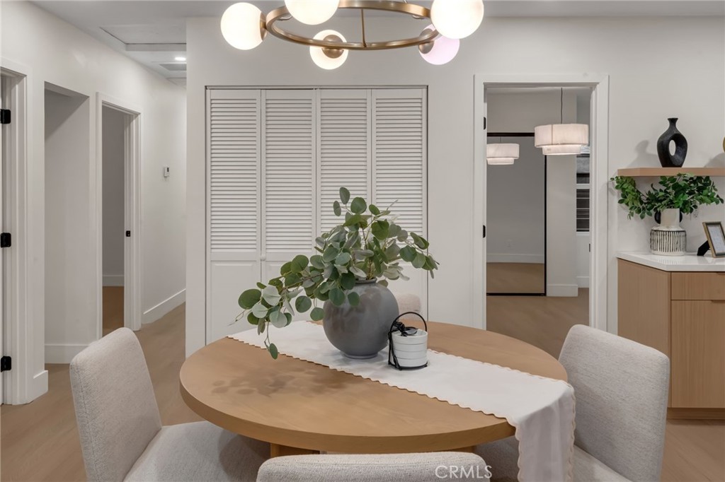 3682 Buckingham Road Los Angeles, CA 90016 - Photo 11 of 30 a dining room with furniture and potted plants
