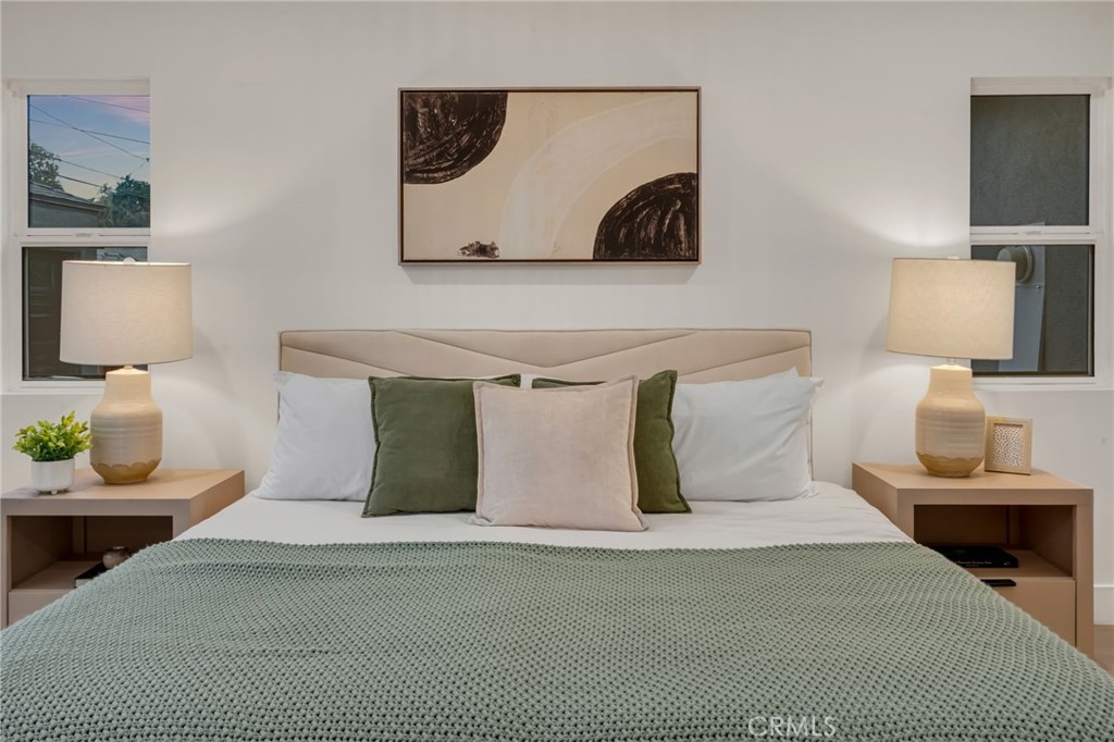 3682 Buckingham Road Los Angeles, CA 90016 - Photo 20 of 30 a bedroom with a bed and painting on the wall