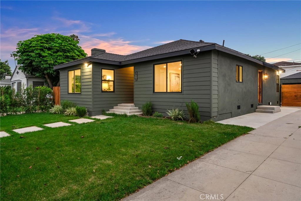 3682 Buckingham Road Los Angeles, CA 90016 - Photo 2 of 30 a front view of a house with garden