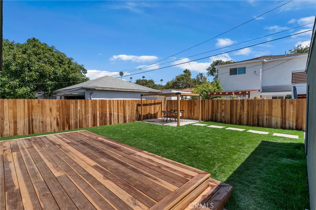 3682 Buckingham Road Los Angeles, CA 90016 - Photo 25 of 30 a view of backyard with wooden fence