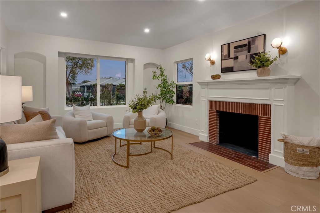 3682 Buckingham Road Los Angeles, CA 90016 - Photo 5 of 30 a living room with furniture and a fireplace