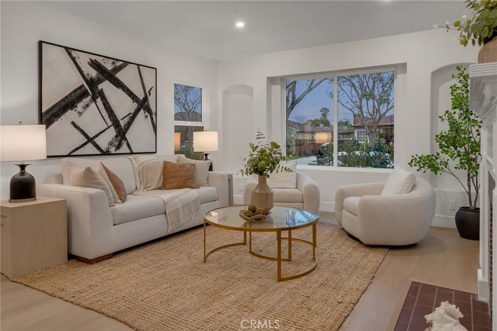 3682 Buckingham Road Los Angeles, CA 90016 - Photo 6 of 30 a living room with furniture and a potted plant