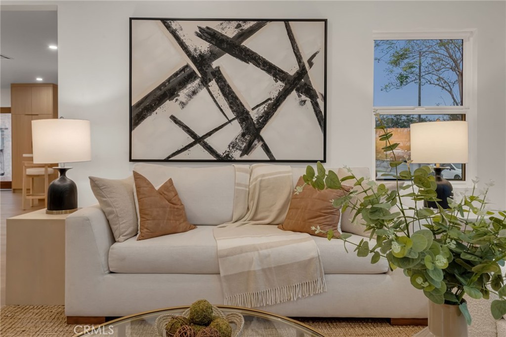 3682 Buckingham Road Los Angeles, CA 90016 - Photo 7 of 30 a living room with furniture and a lamp
