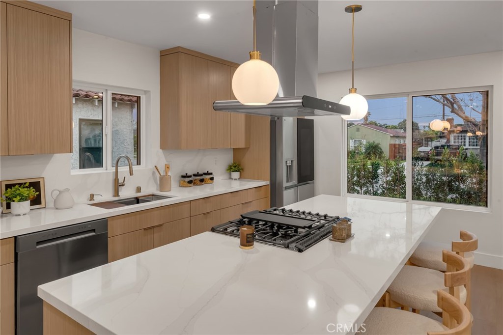 3682 Buckingham Road Los Angeles, CA 90016 - Photo 10 of 30 a kitchen with sink refrigerator and stove