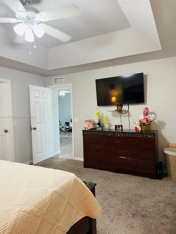 a bed room with flat screen tv and a bed