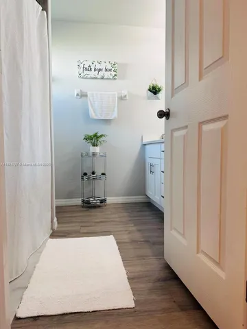 a view of kitchen with furniture wooden floor and window
