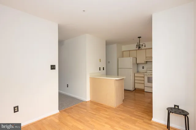 a view of kitchen with white cabinets