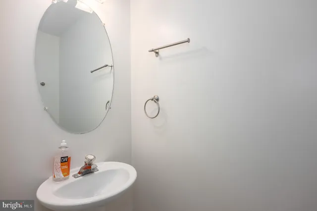 a bathroom with a sink and mirror