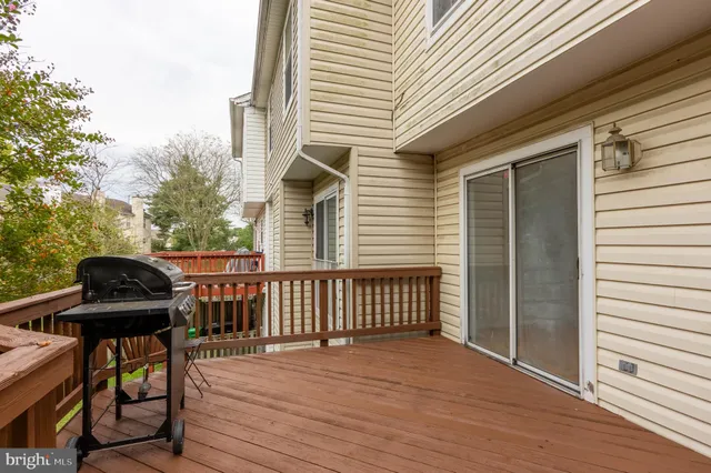 a view of a patio with a table and chairs