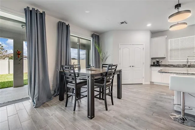 a view of a dining room with furniture window and outside view