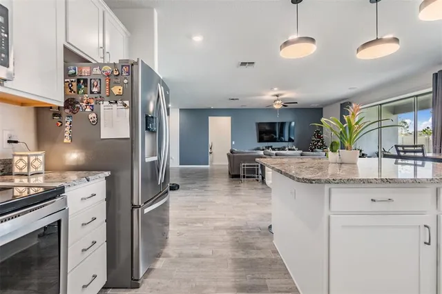 a large kitchen with a lot of counter space and a sink
