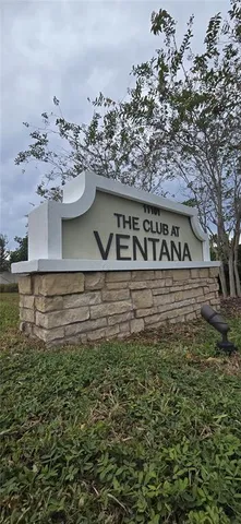 a view of a lake with a table and chairs