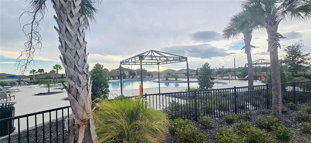 a view of swimming pool with outdoor seating