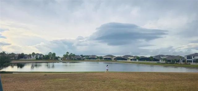 a view of a house with backyard porch and sitting area