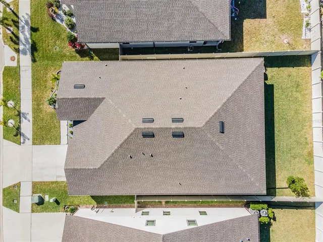 an aerial view of residential house with outdoor space