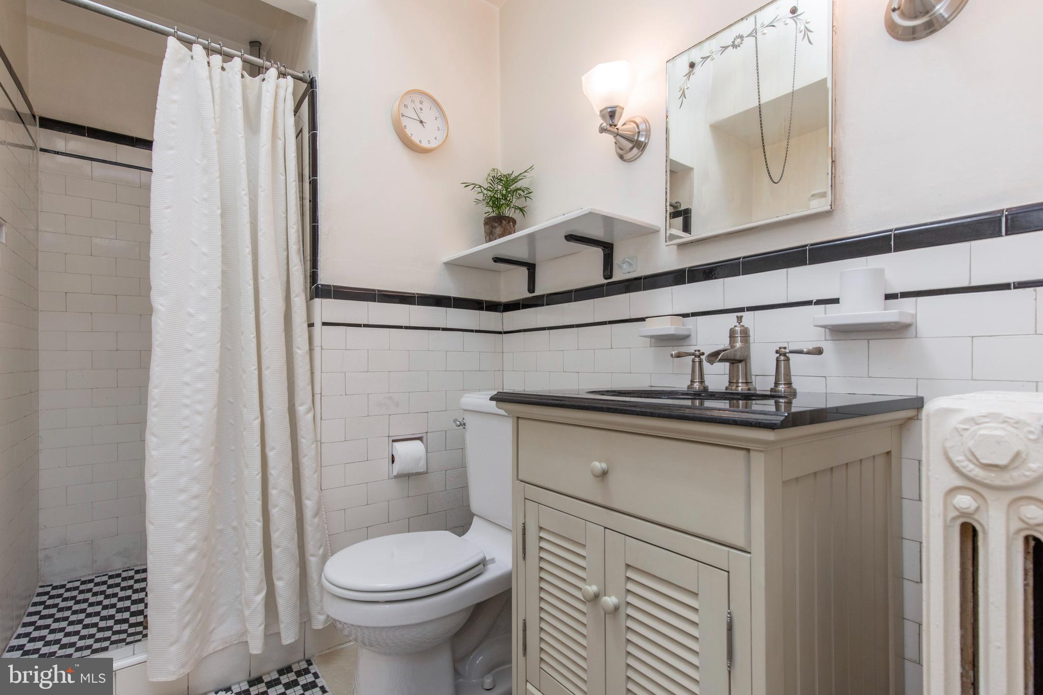 148 Roumfort Road Philadelphia, PA 19119 - Photo 22 of 33 Hall bathroom with tub and shower