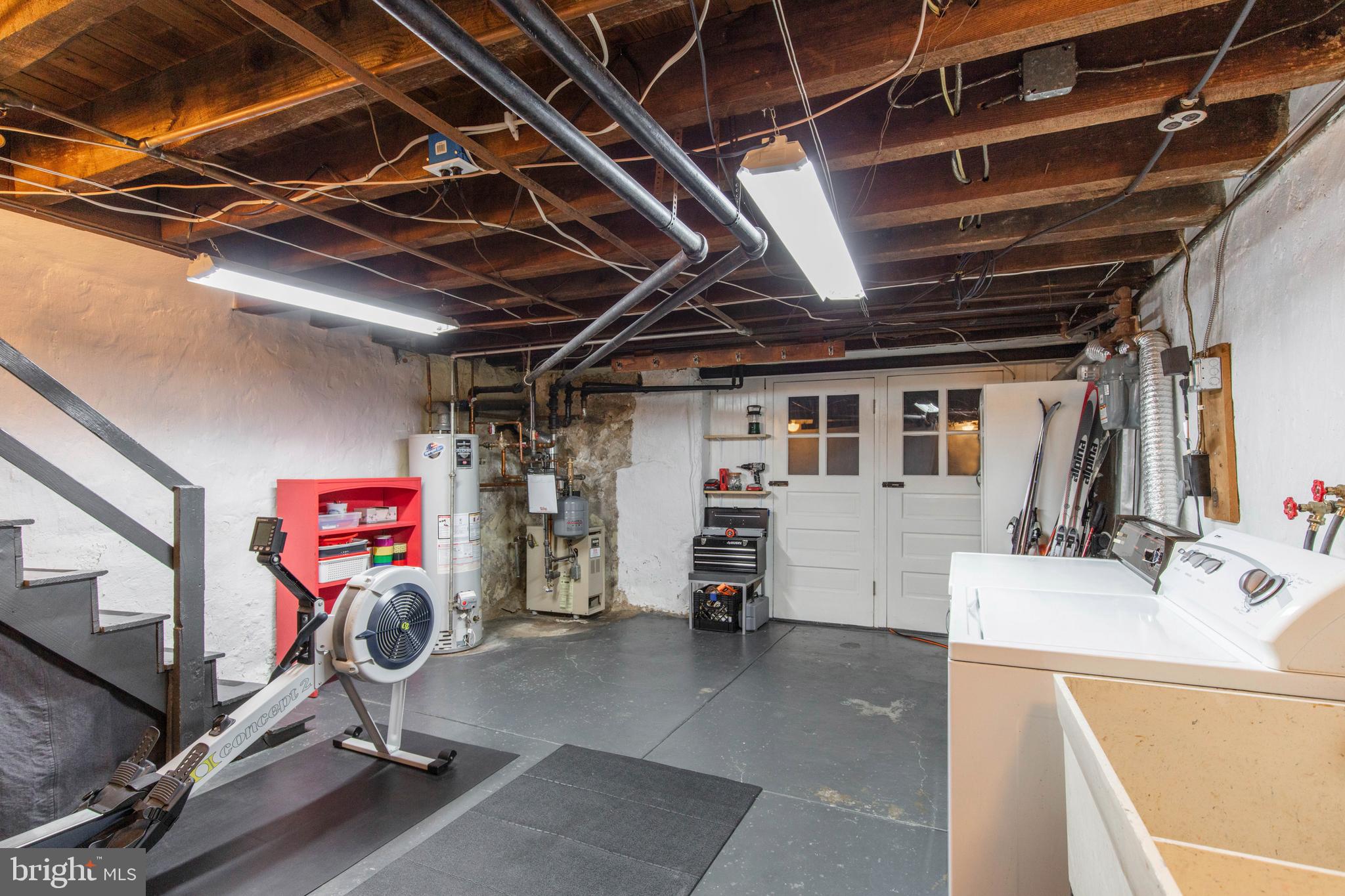 148 Roumfort Road Philadelphia, PA 19119 - Photo 27 of 33 Laundry area with workout space