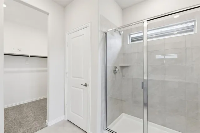 a bathroom with a double vanity sink and mirror