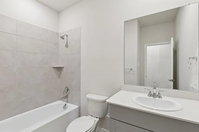 a bathroom with a double vanity sink and mirror