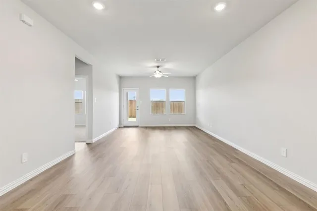 a kitchen with stainless steel appliances granite countertop a sink stove oven and refrigerator