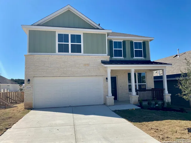 a front view of a house with a garage
