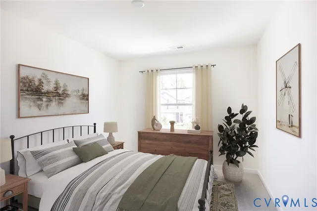 a bedroom with bed and a window