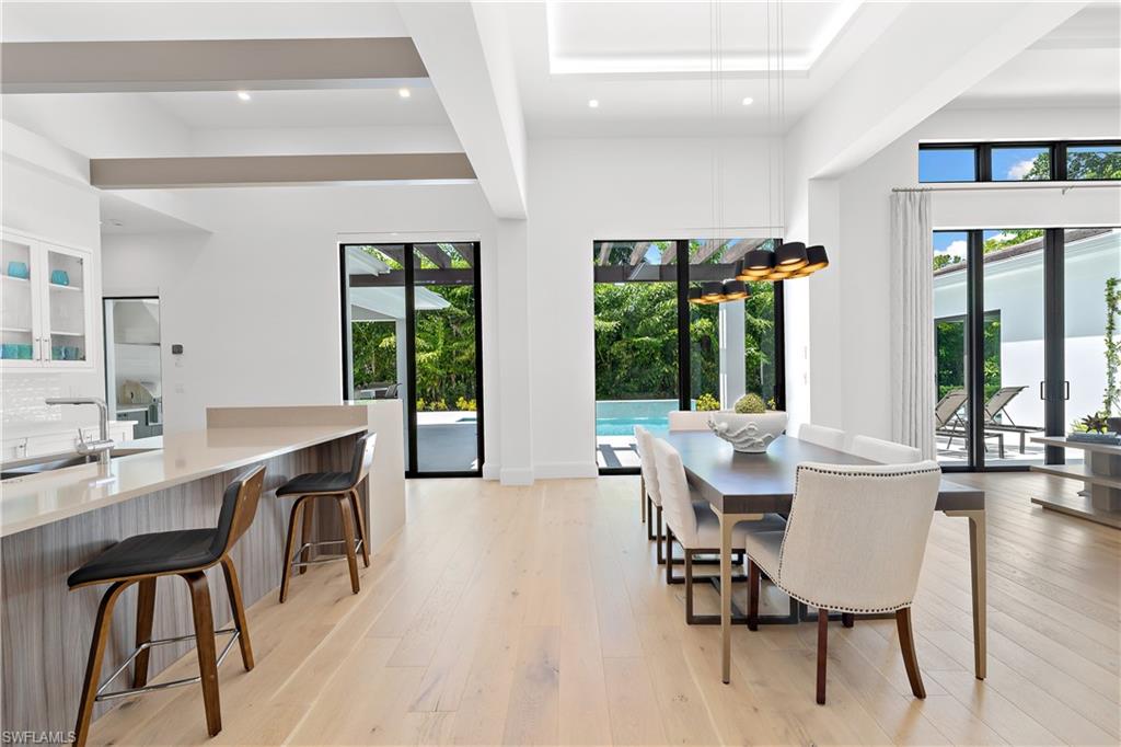 470 Wedge Drive Naples, FL 34103 - Photo 8 of 28 a view of a dining room with furniture window and outside view