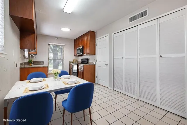 a view of a dining room with furniture